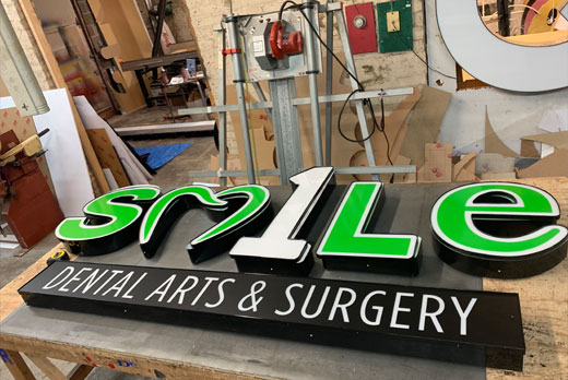 Neon sign featuring smile dental neon sign fabrication