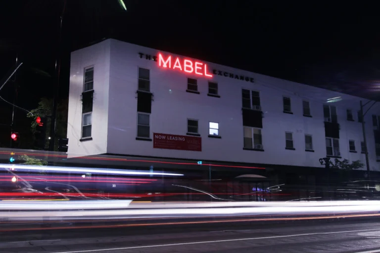 Building Name Red Neon in vibrant LED neon