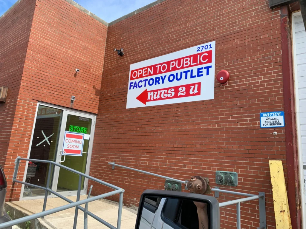Factory Store Coming Soon in glowing neon signage style