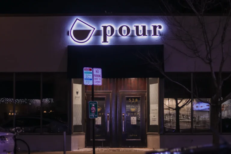 Pour Cafe Front Lit Sign in vibrant LED neon