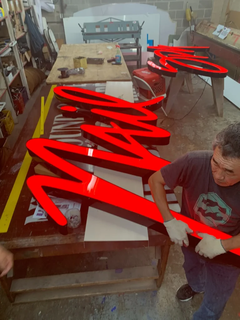 red acrylic logo installation neon sign by NeonArts