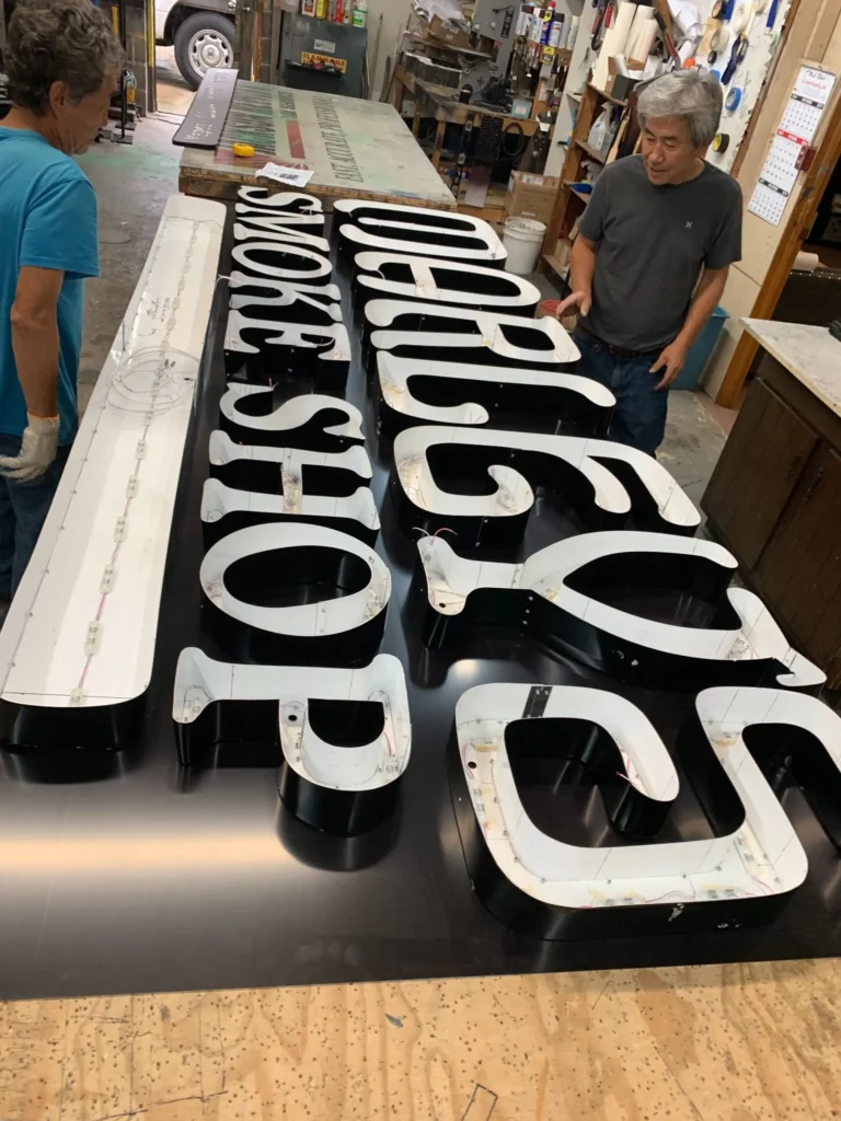 Neon sign featuring smoke shop channel letter production