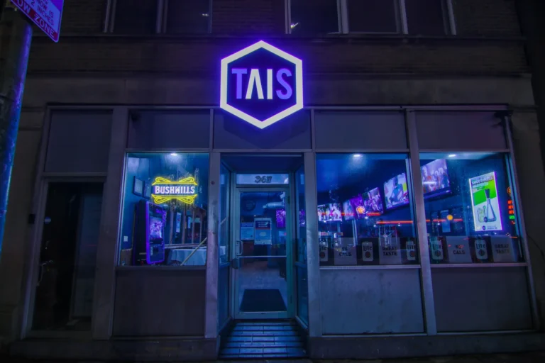 Tais Bar Hexagon Logo Sign in vibrant LED neon