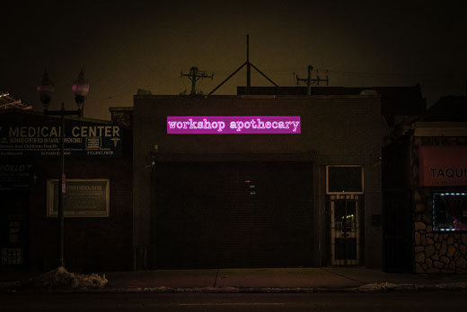 Neon sign in image featuring neonarts apothecary purple neon